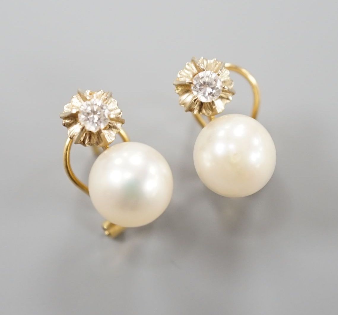A modern pair of Italian 750 yellow metal, culture pearl and diamond set earrings, 14mm, gross weight 4.2 grams.